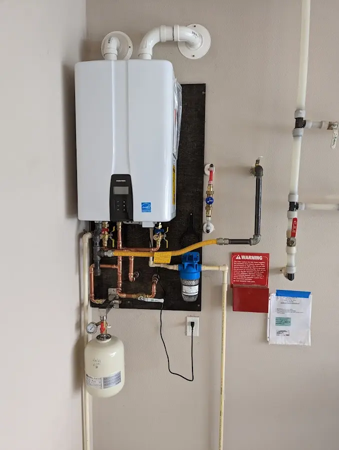 Professional plumber installing copper piping in a Hickory home